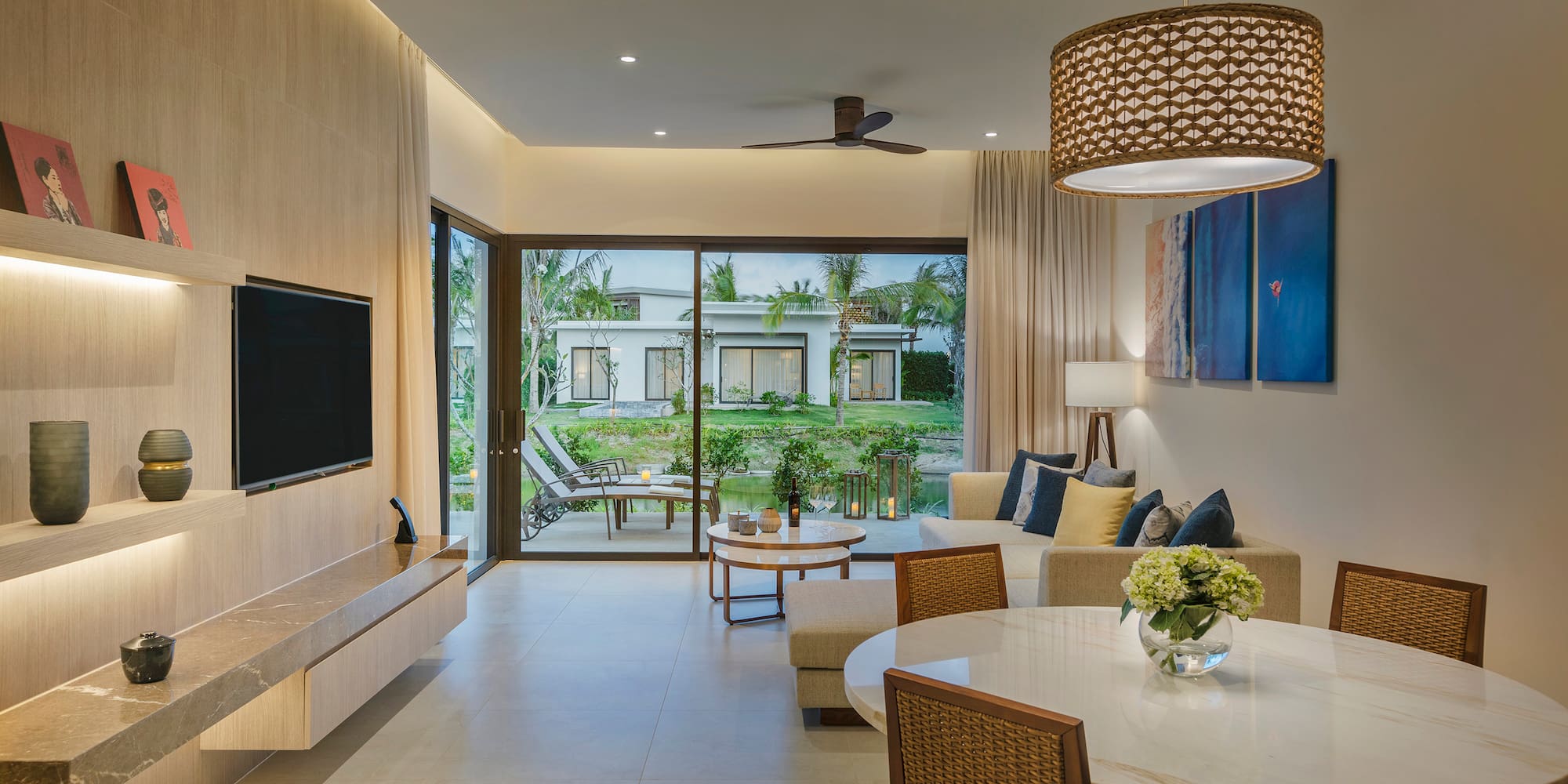 a living room with a television and a table