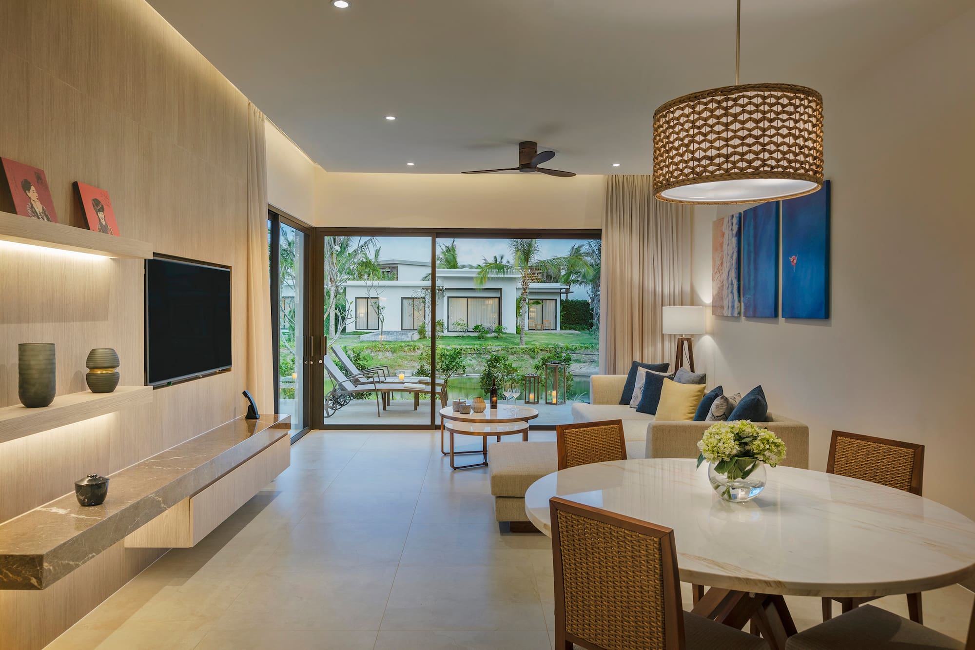a living room with a television and a table