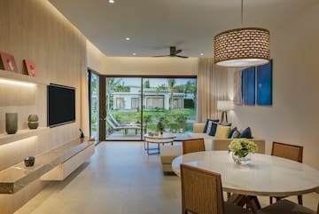 a living room with a television and a table