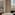 Luxury hotel suite with city view, freestanding bathtub, and elegant vanity.
