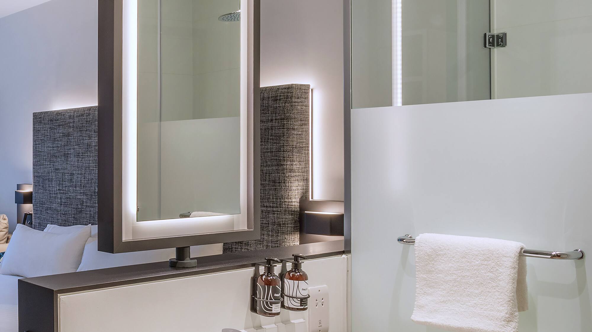 a bathroom with a mirror and sink