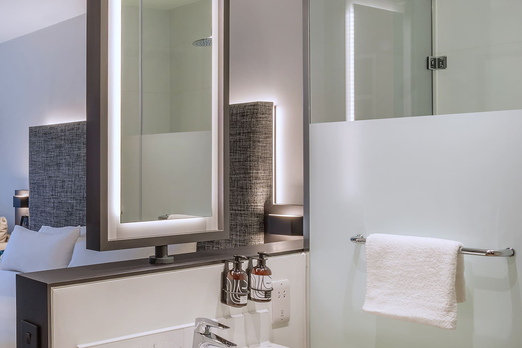 a bathroom with a mirror and sink