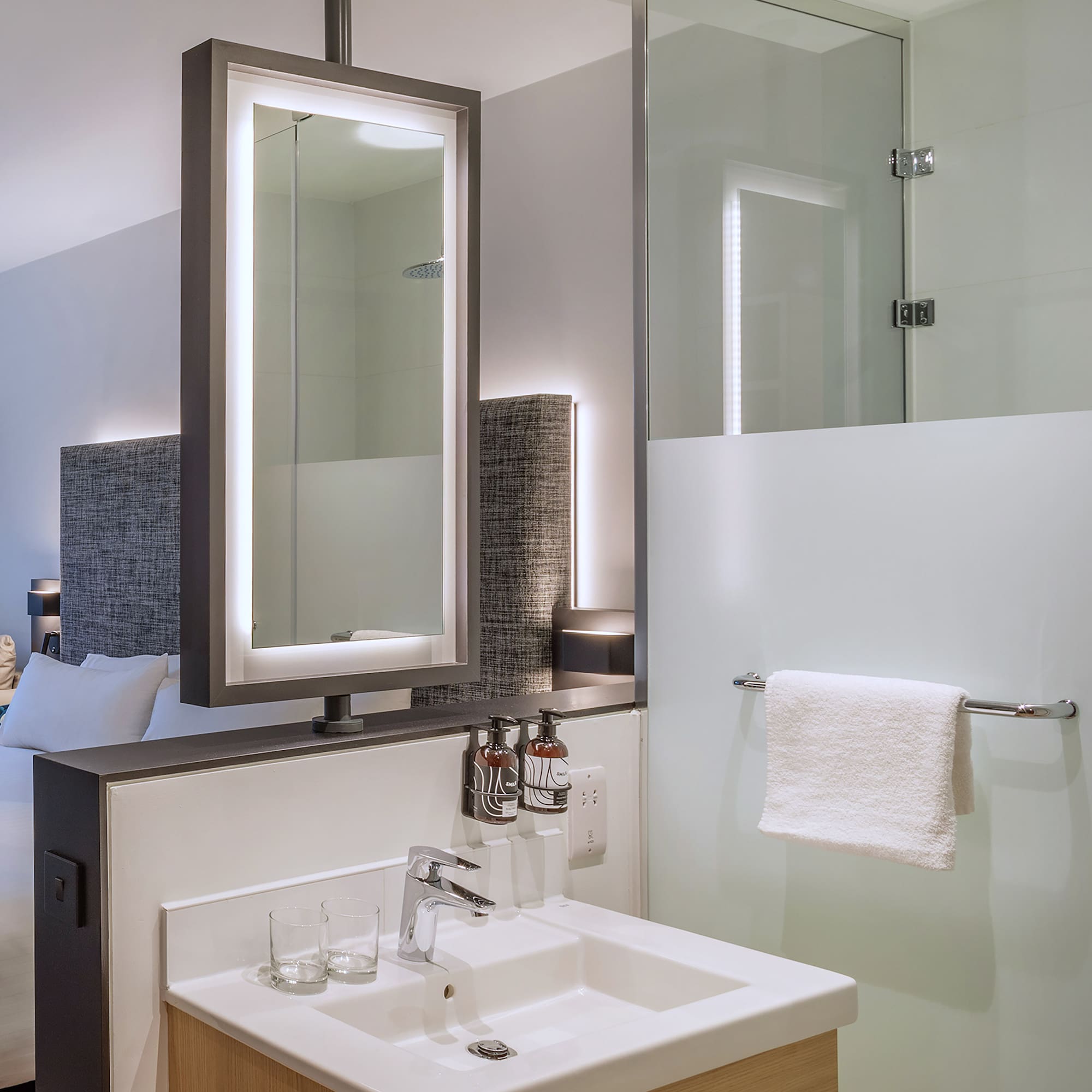 a bathroom with a mirror and sink