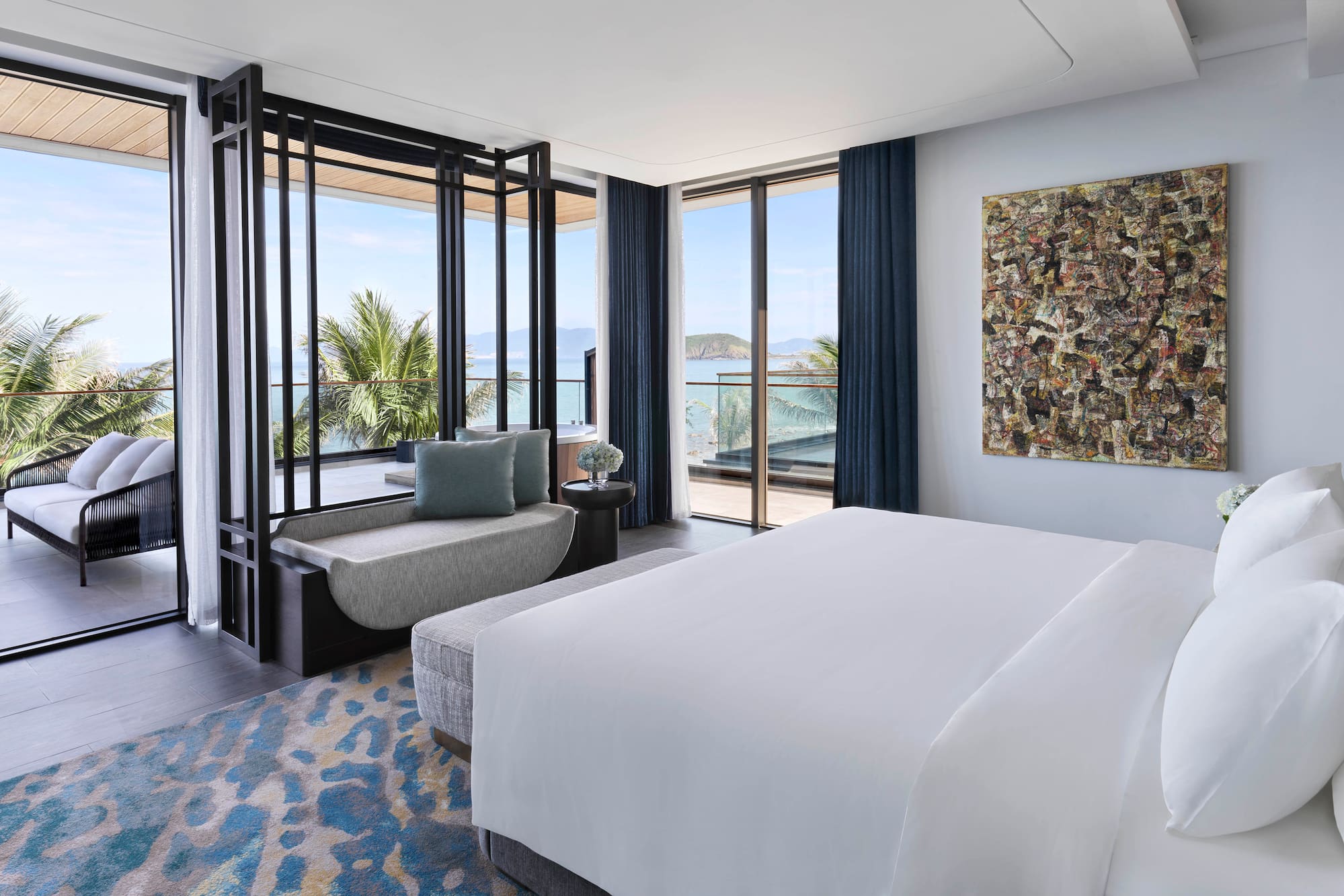 a bedroom with a bed and a couch