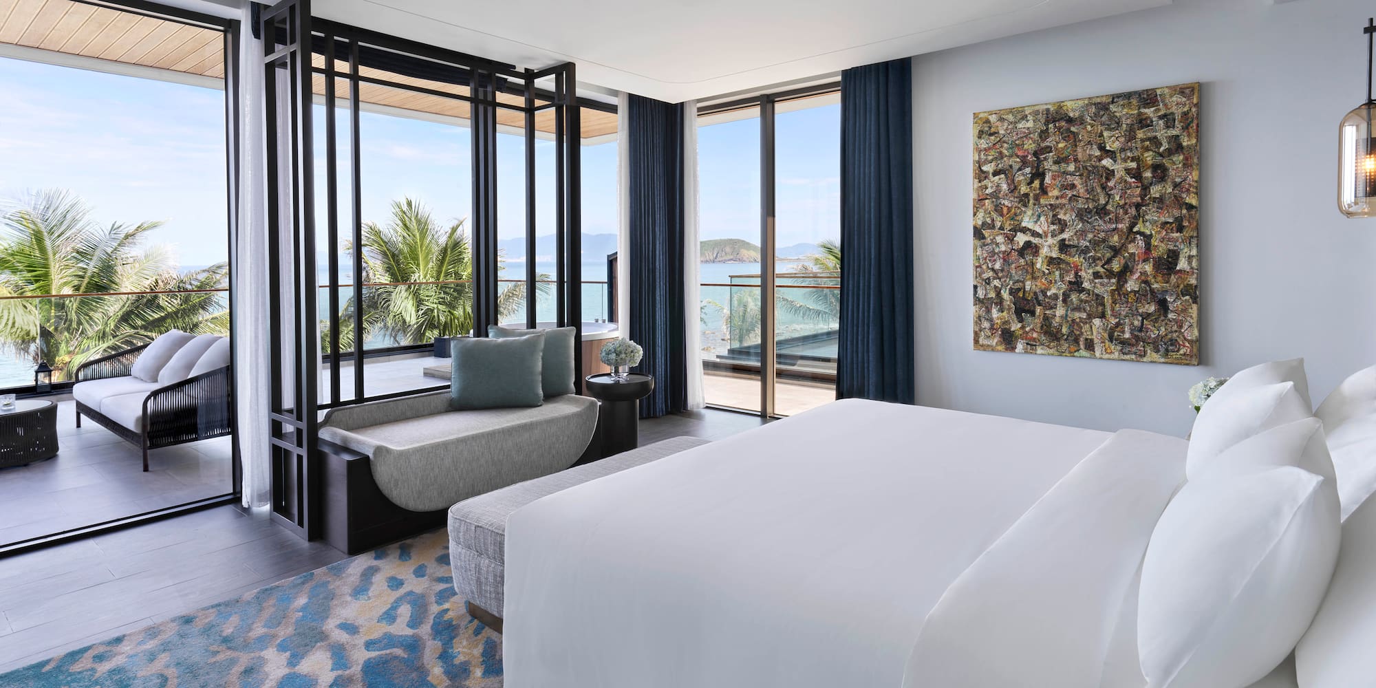 a bedroom with a bed and a couch