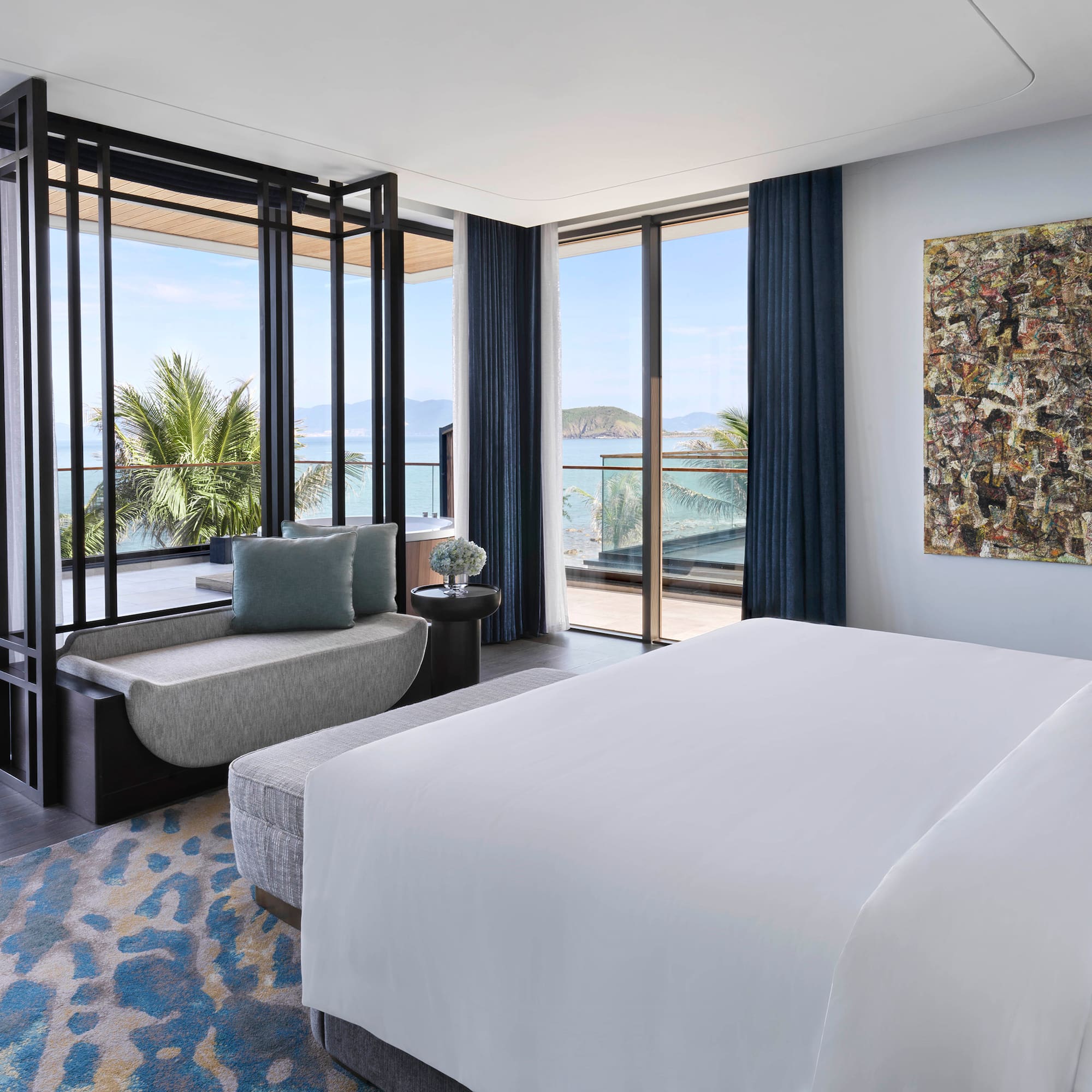 a bedroom with a bed and a couch