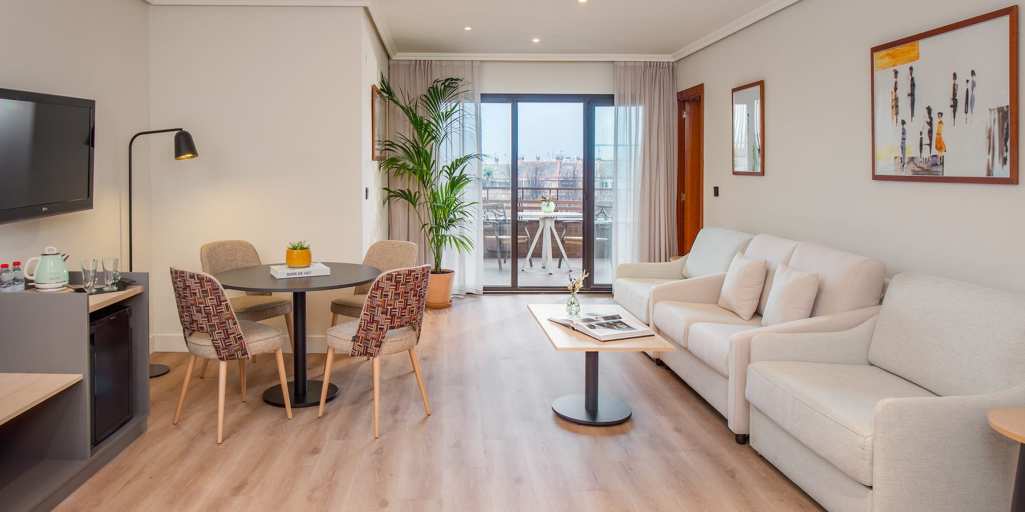a living room with a table and chairs
