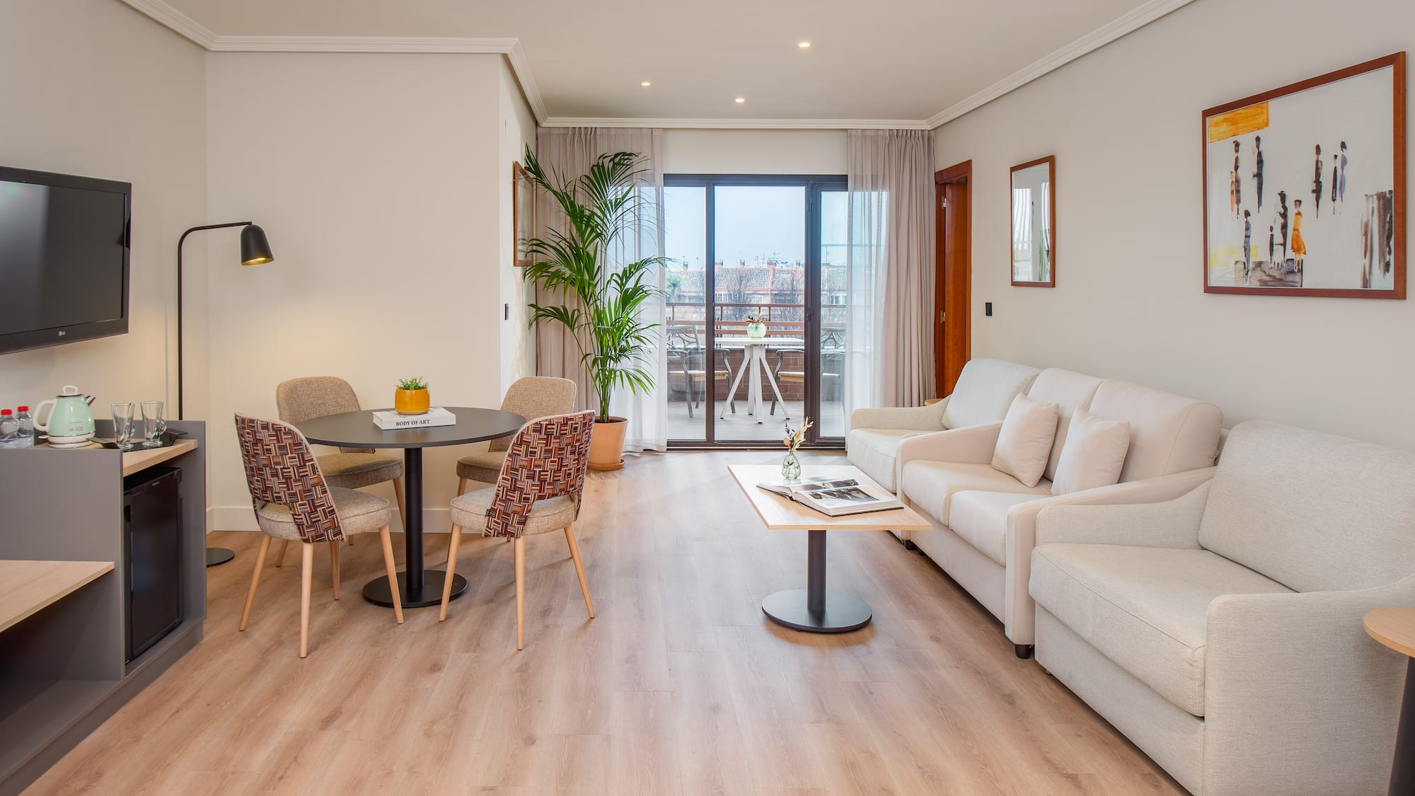 a living room with a table and chairs