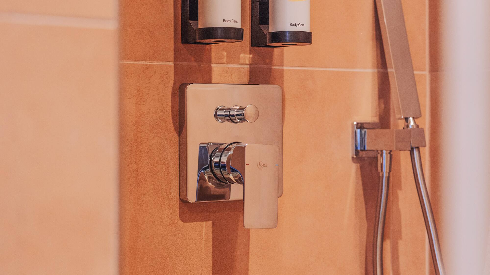 a shower with a shower head and shower head