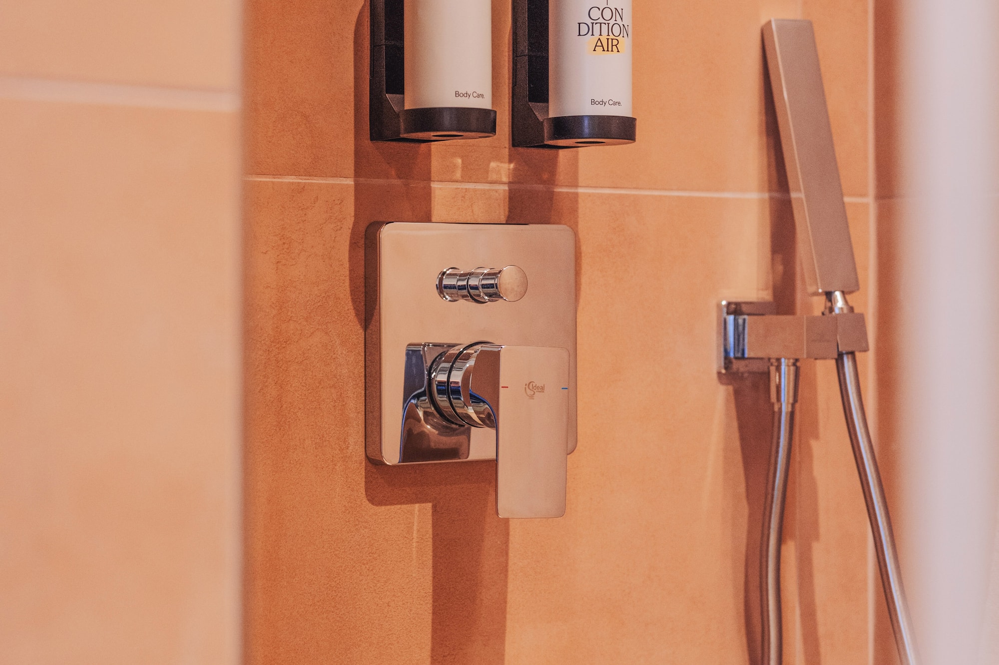 a shower with a shower head and shower head