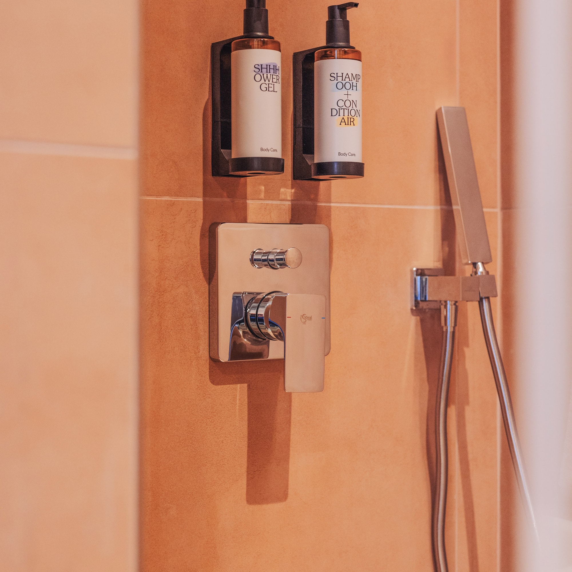 a shower with a shower head and shower head