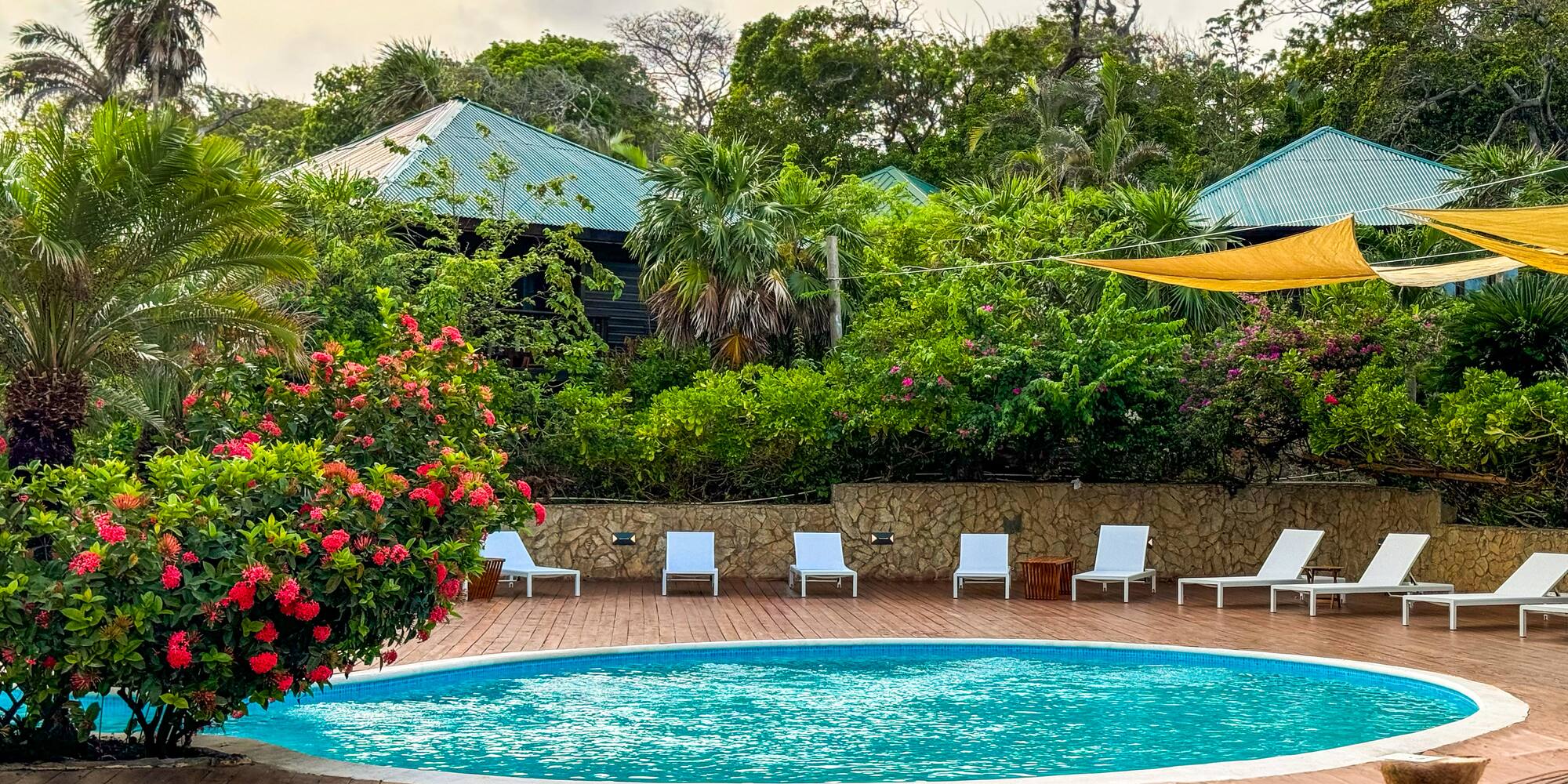 a pool with chairs around it