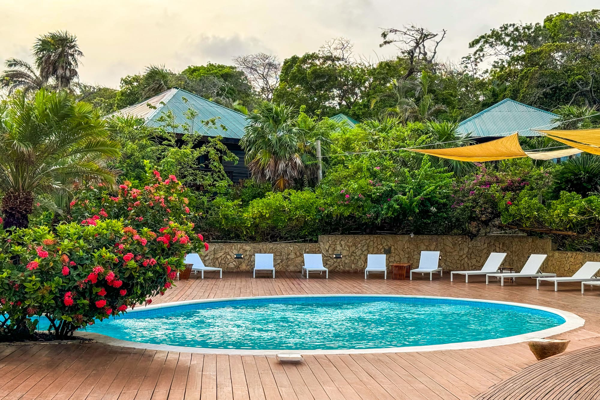 a pool with chairs around it