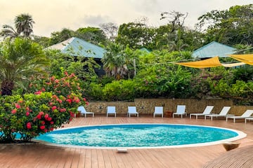 a pool with chairs around it