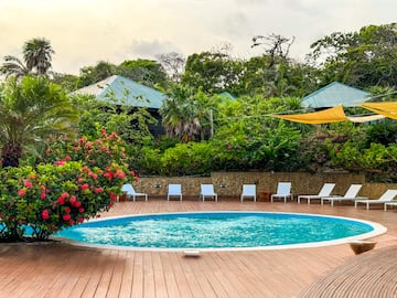 a pool with chairs around it