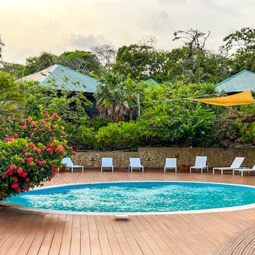 a pool with chairs around it