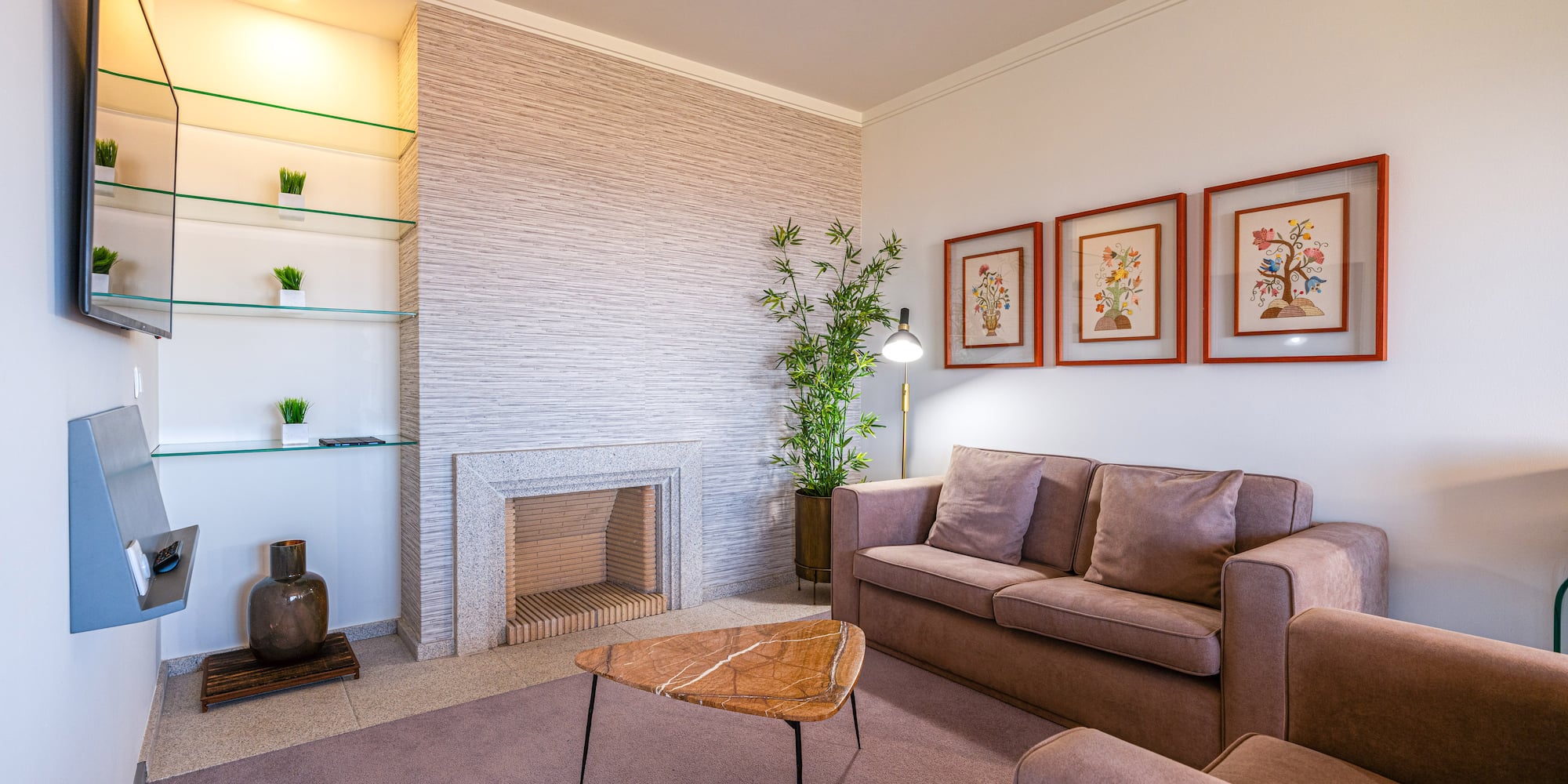 a living room with a fireplace and couch