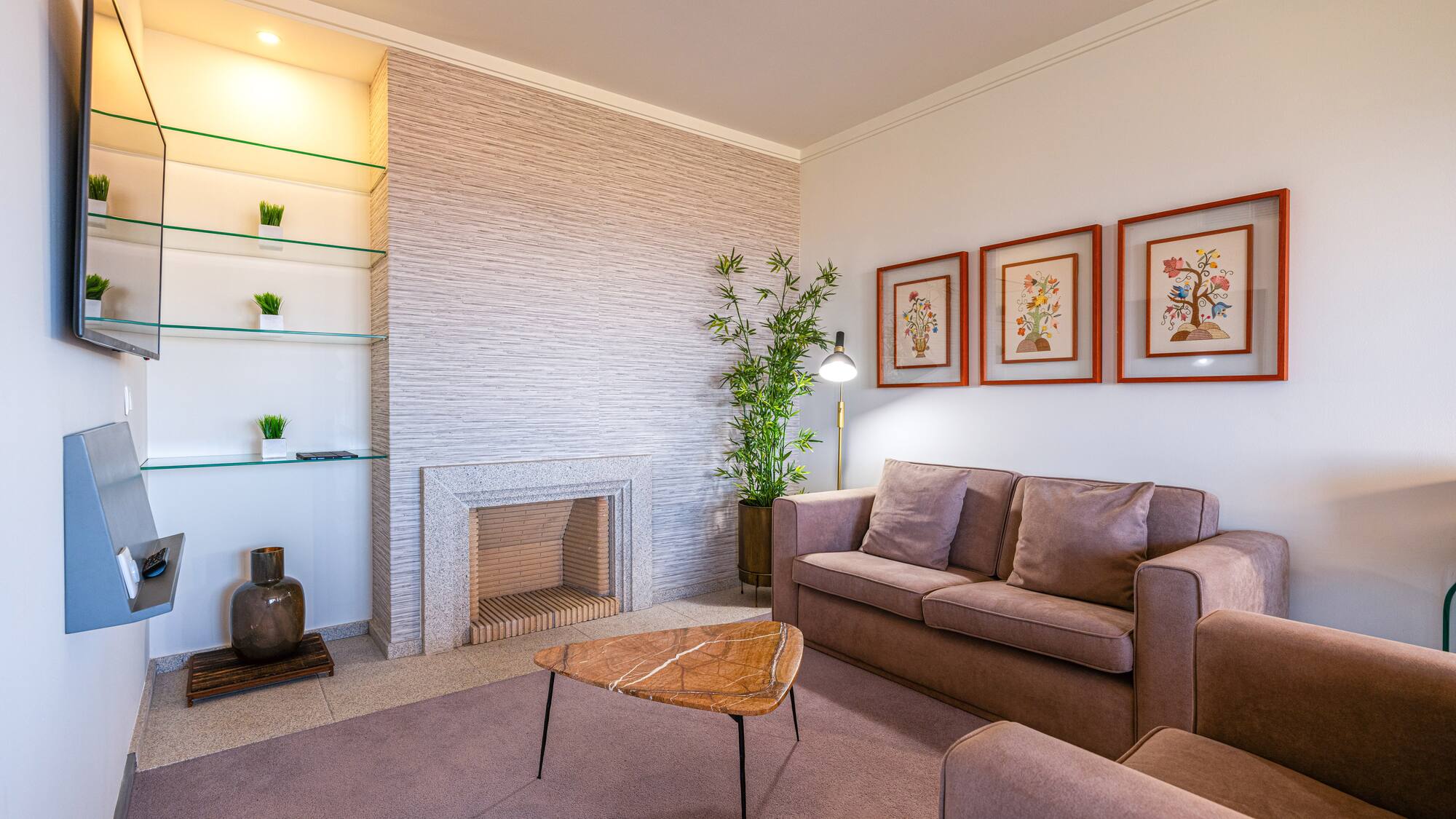 a living room with a fireplace and couch