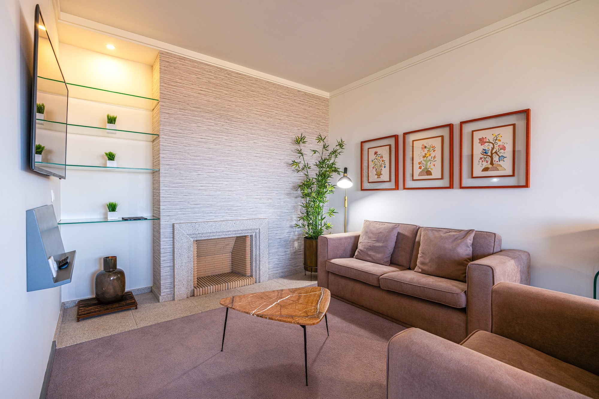 a living room with a fireplace and couch