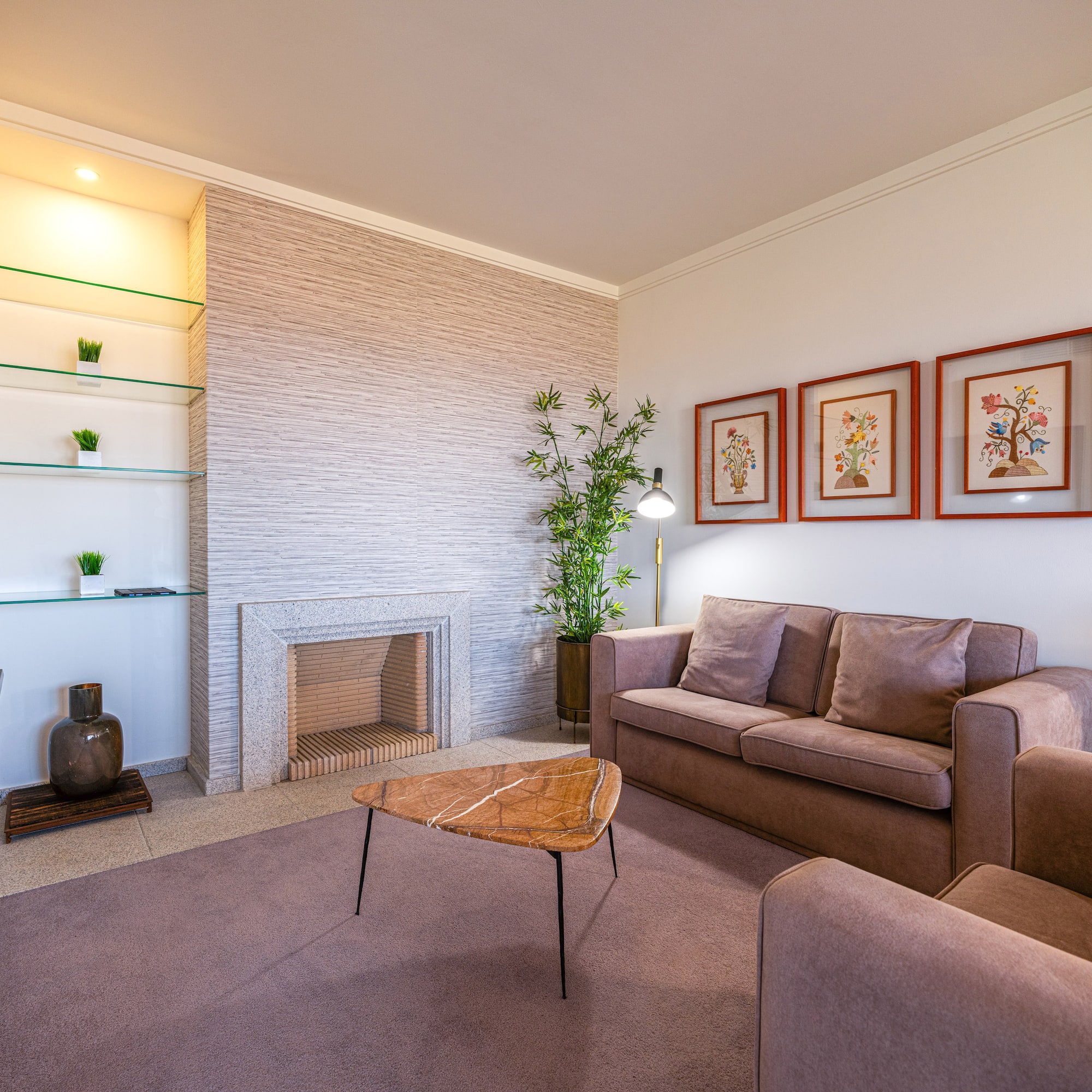 a living room with a fireplace and couch