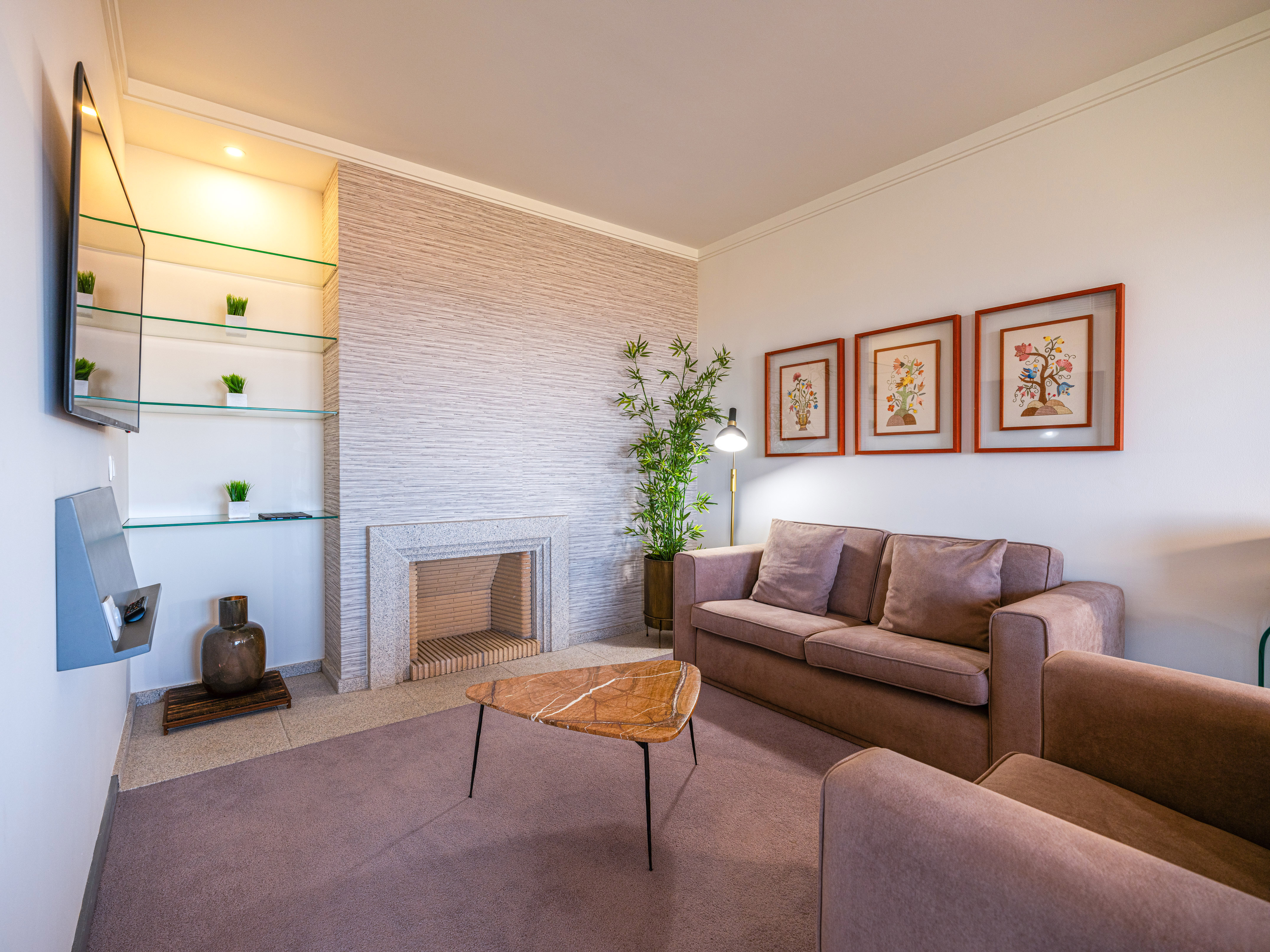 a living room with a fireplace and couch