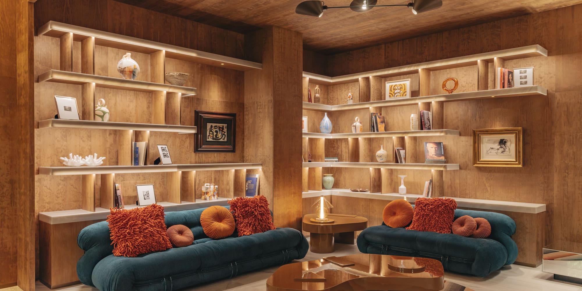 a room with shelves and couches