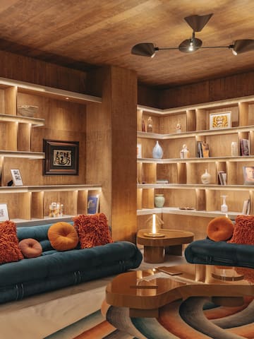 a room with shelves and couches