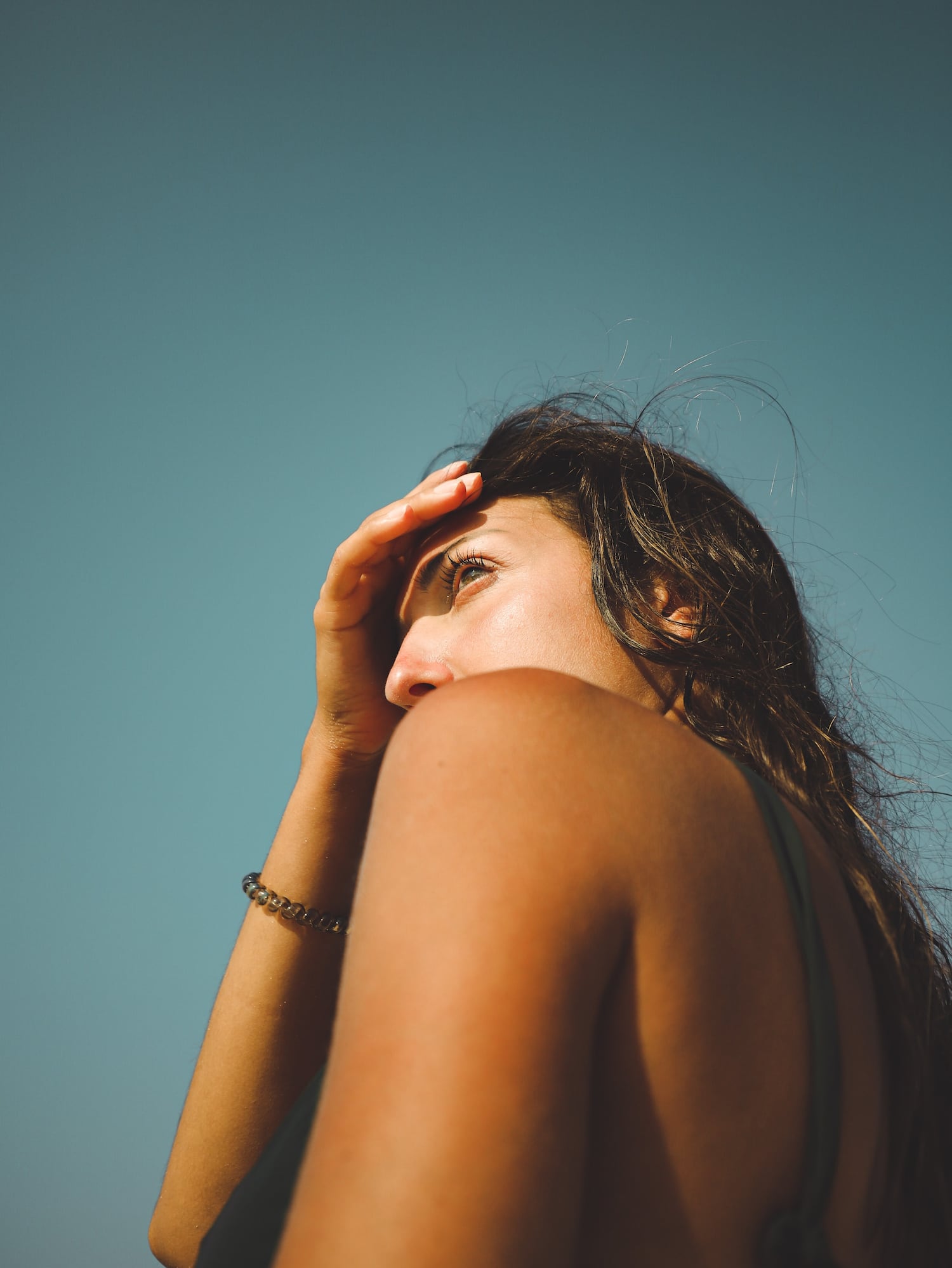a woman holding her head