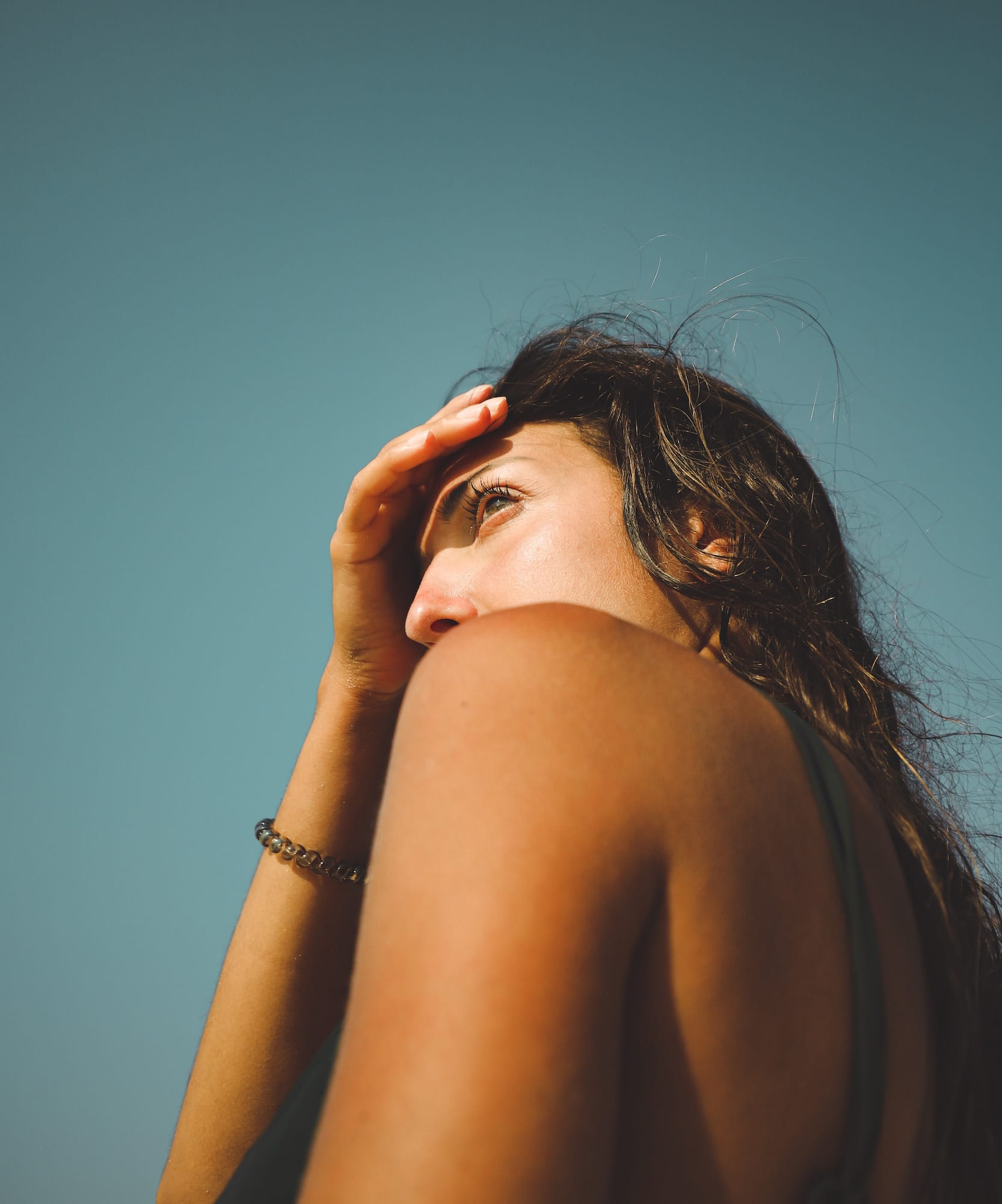 a woman holding her head