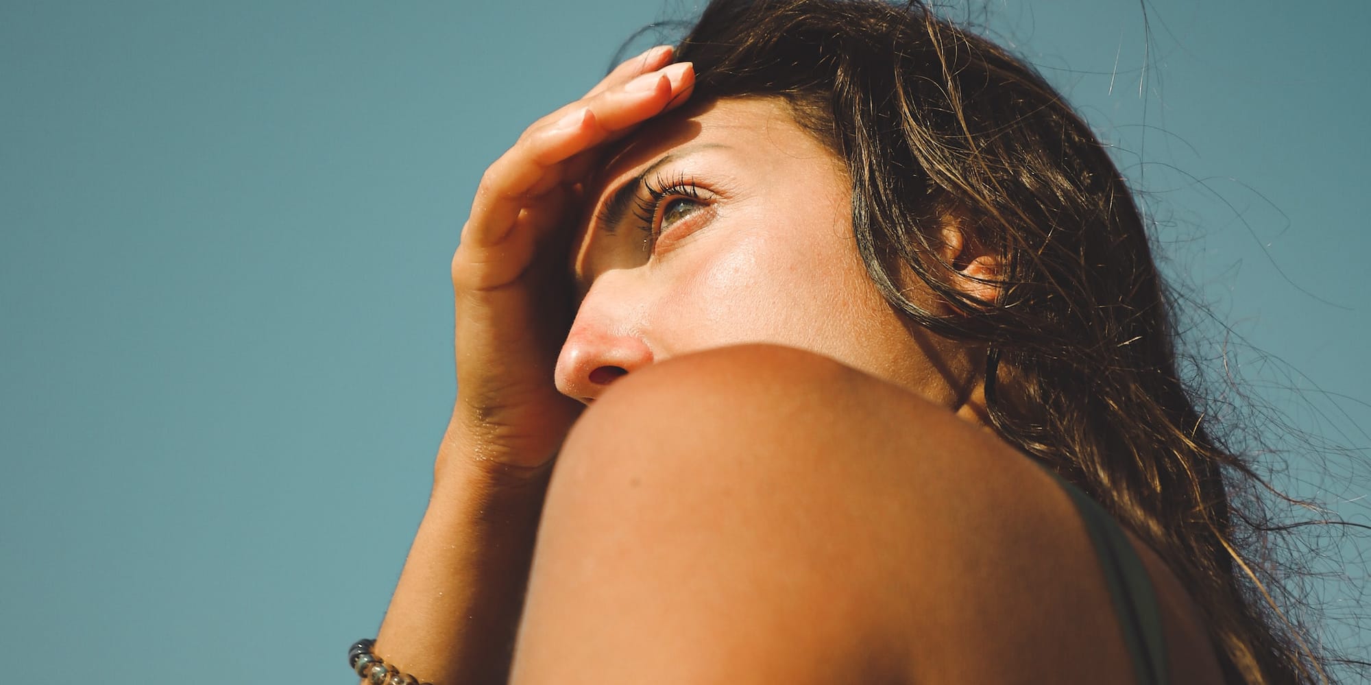 a woman holding her head