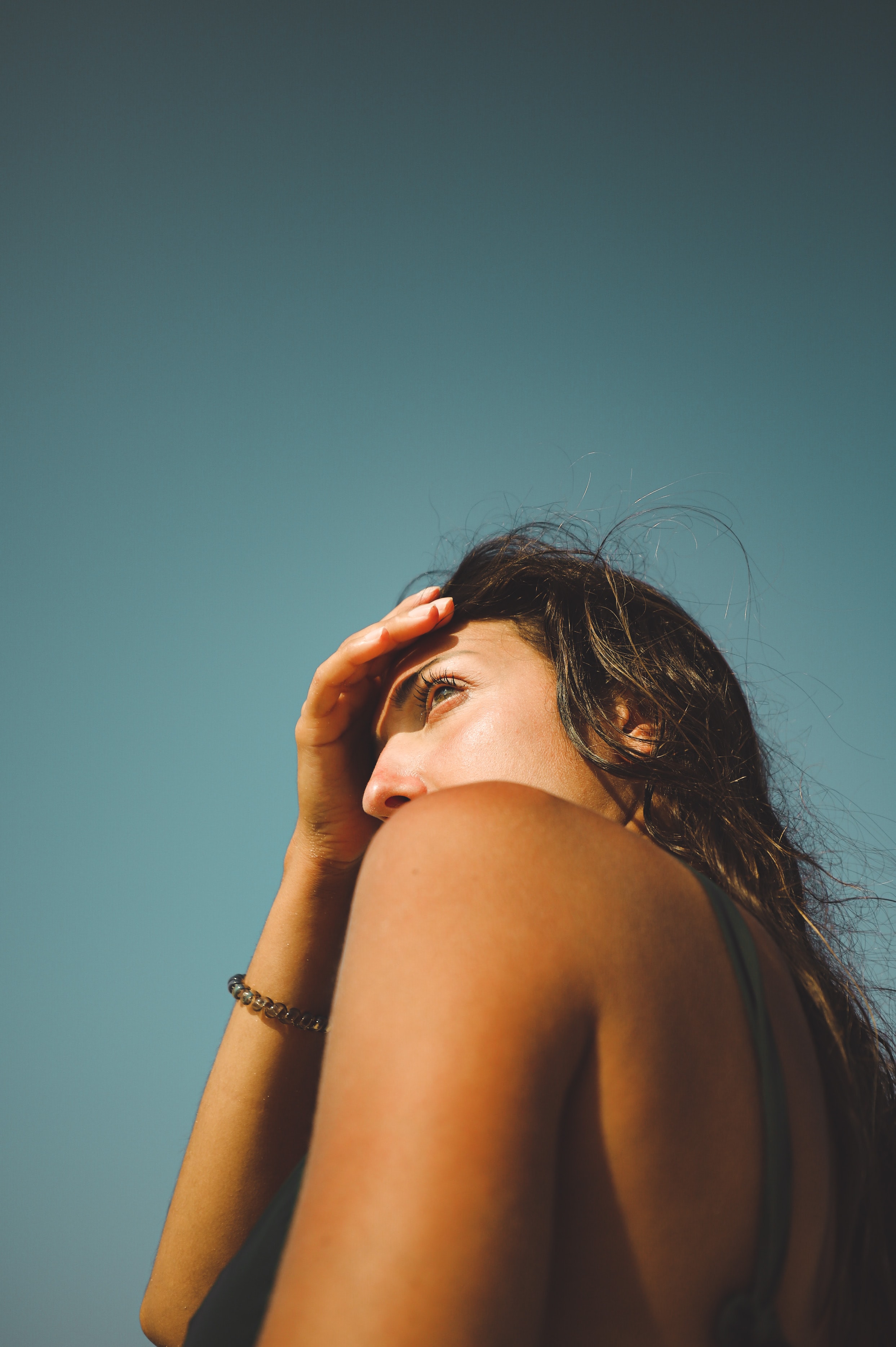 a woman holding her head
