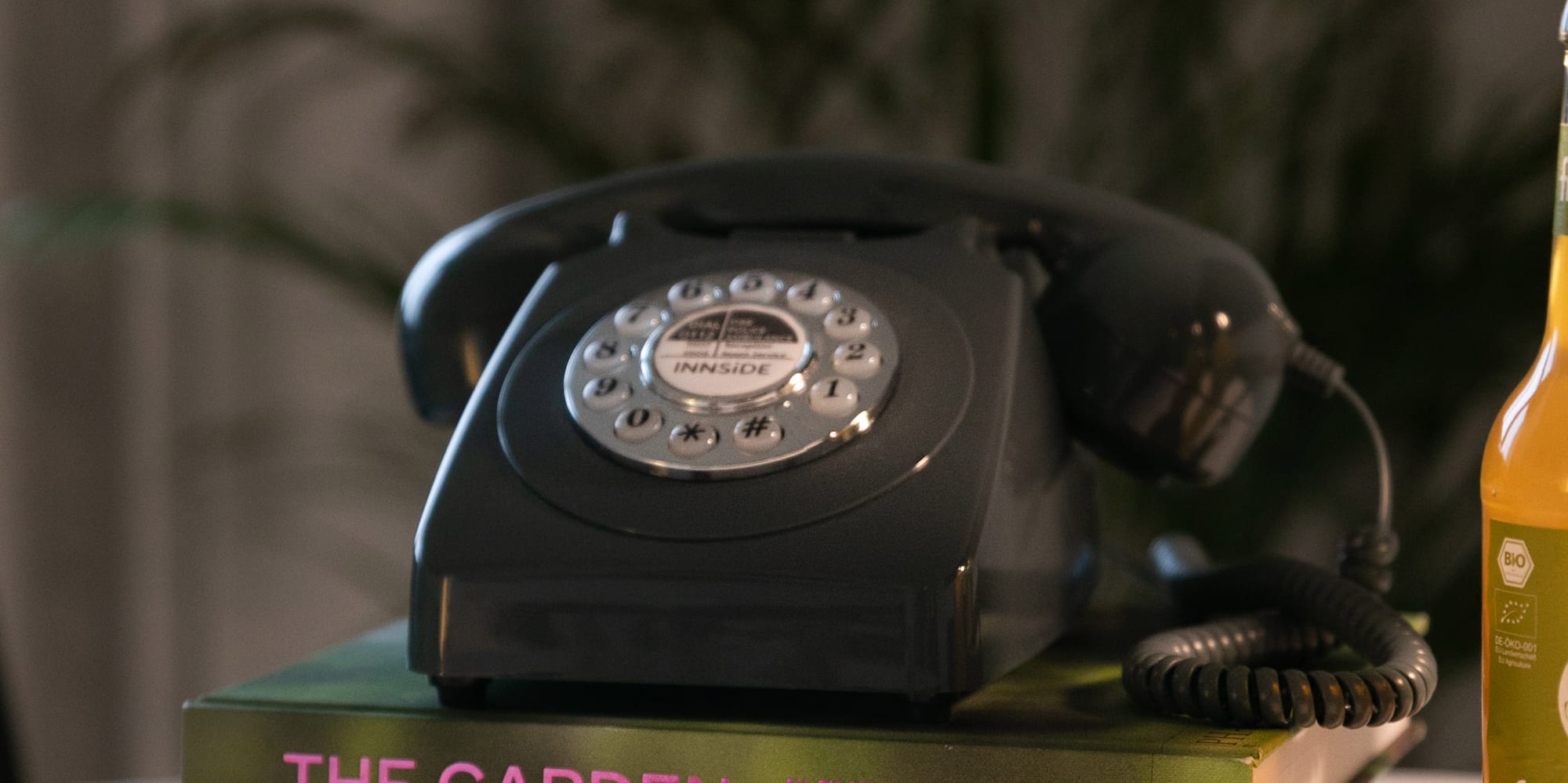 a telephone on top of books