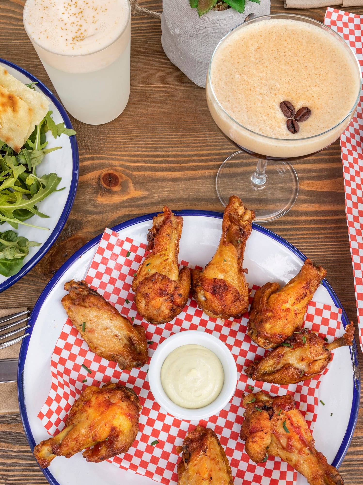 a table with plates of food and drinks