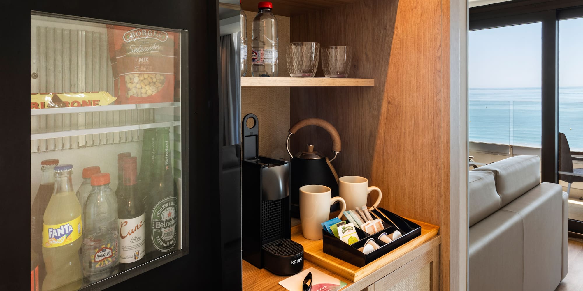 a coffee machine and coffee cups on a shelf