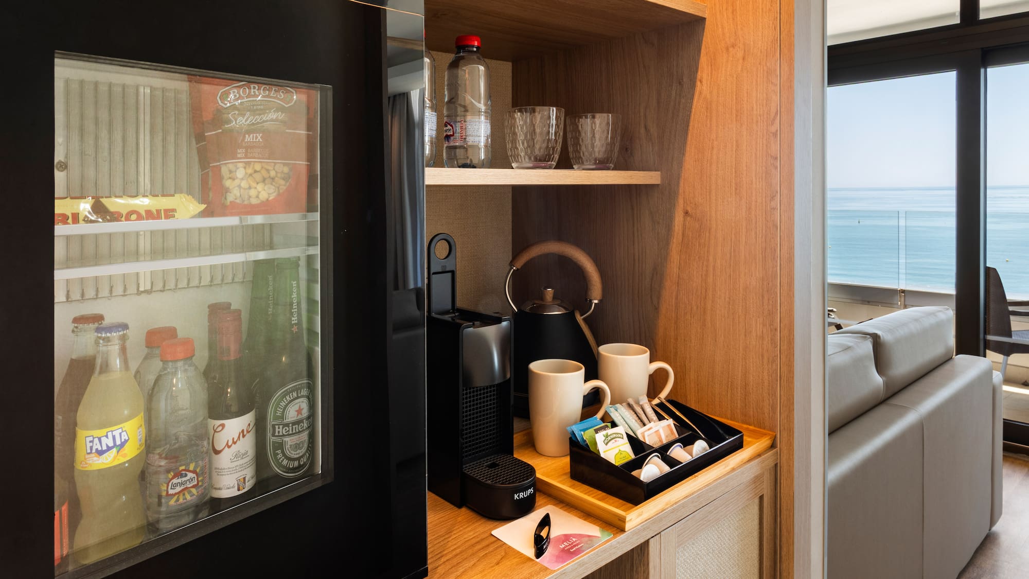 a coffee machine and coffee cups on a shelf