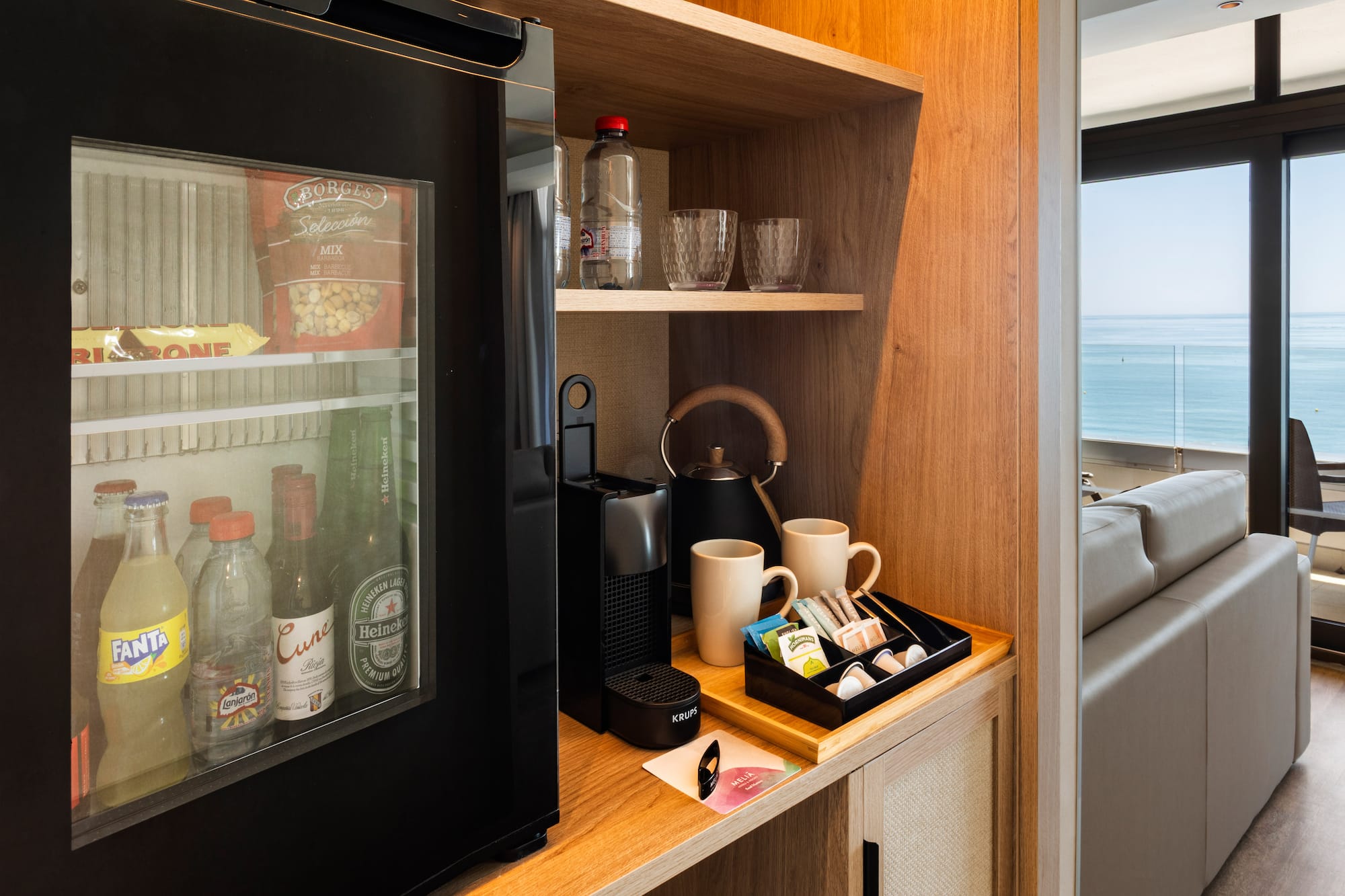 a coffee machine and coffee cups on a shelf