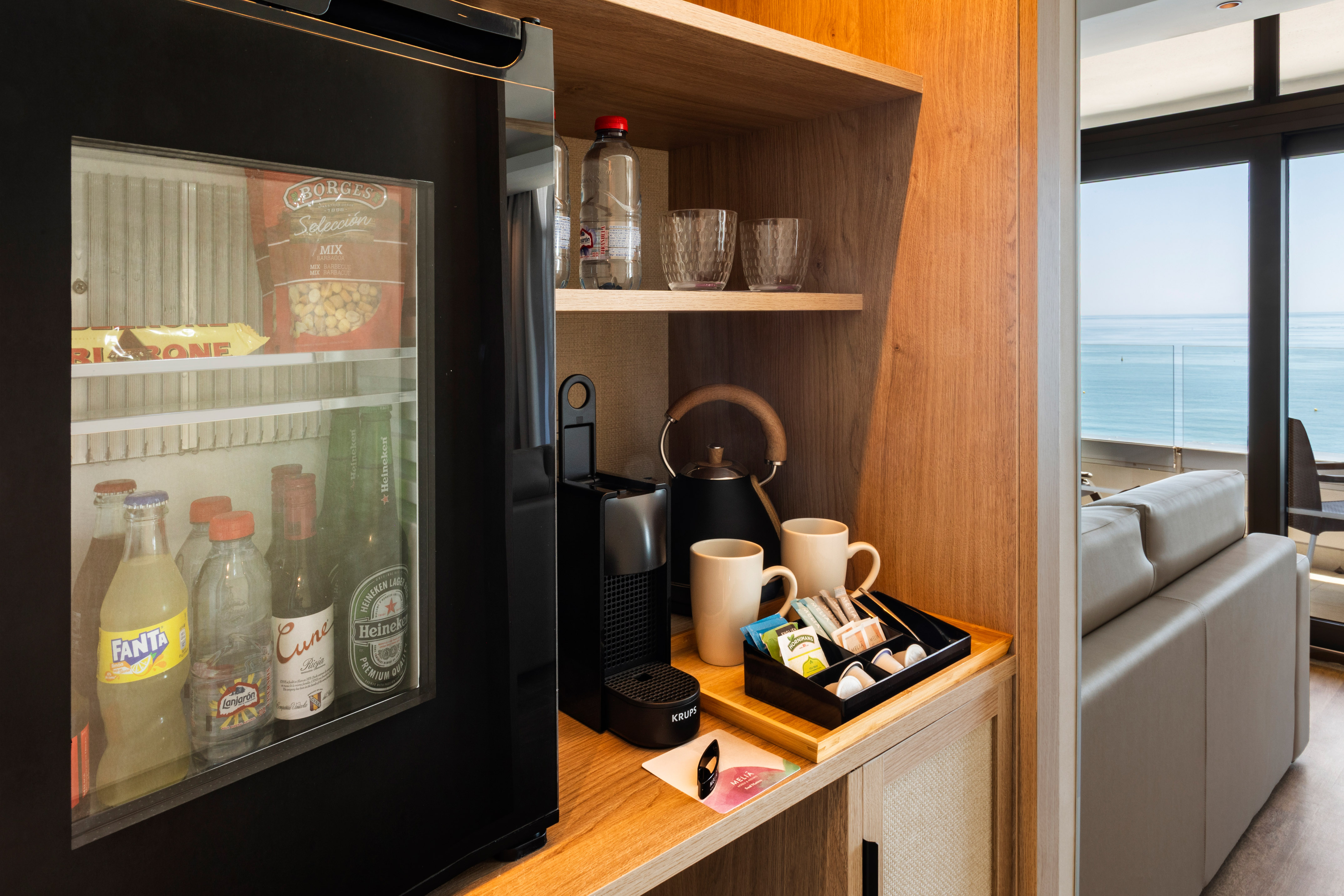 Meliá hotel room minibar, Nespresso, snacks, and ocean view.