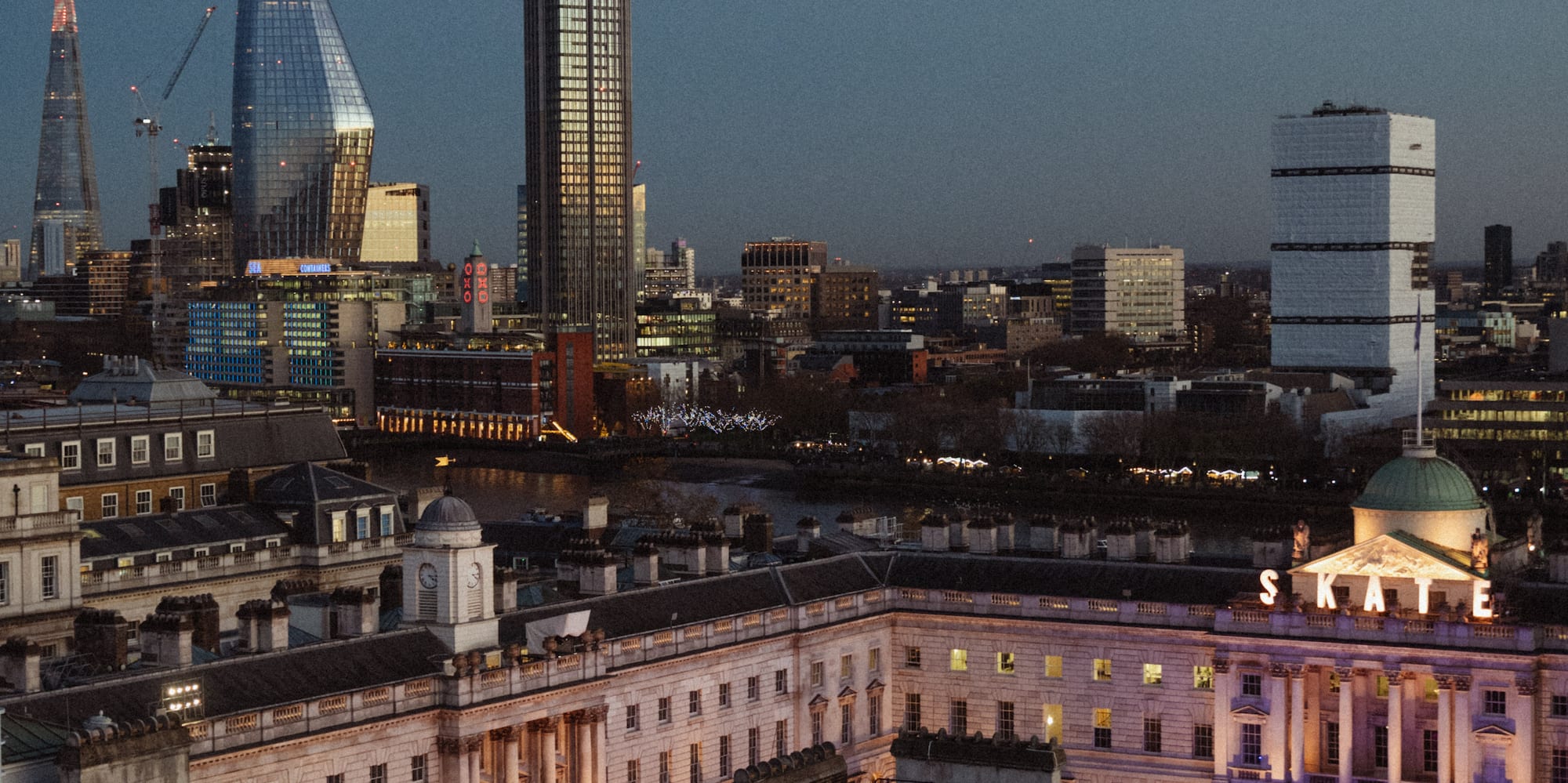 a city skyline with a large building and a large building