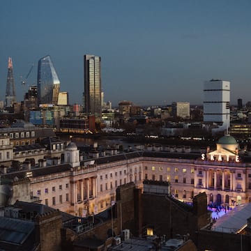 a city skyline with a large building and a large building
