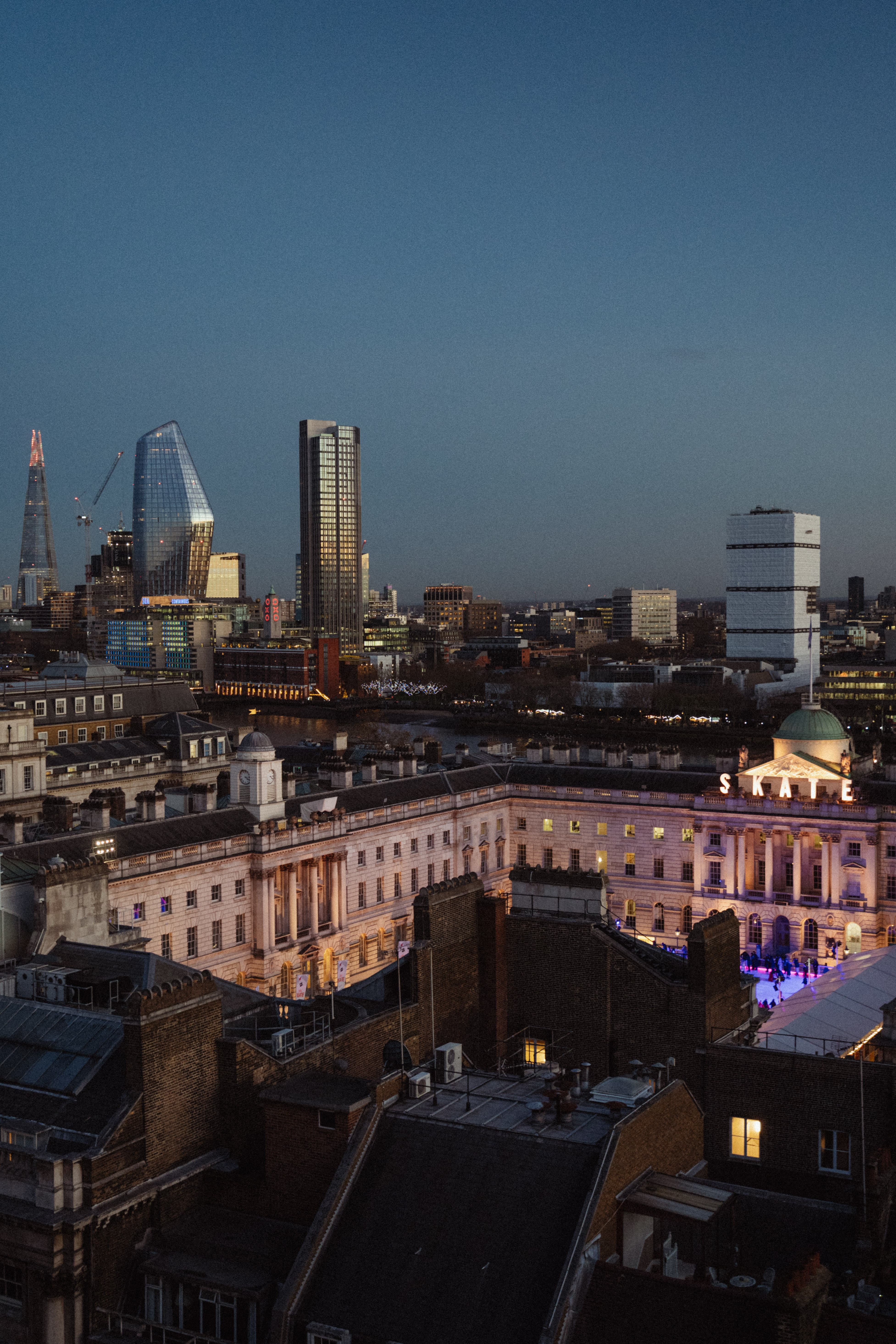 a city skyline with a large building and a large building