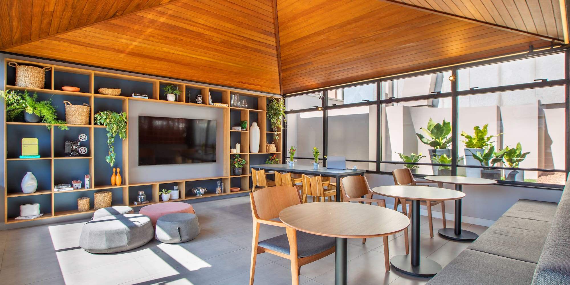 a room with a television and tables