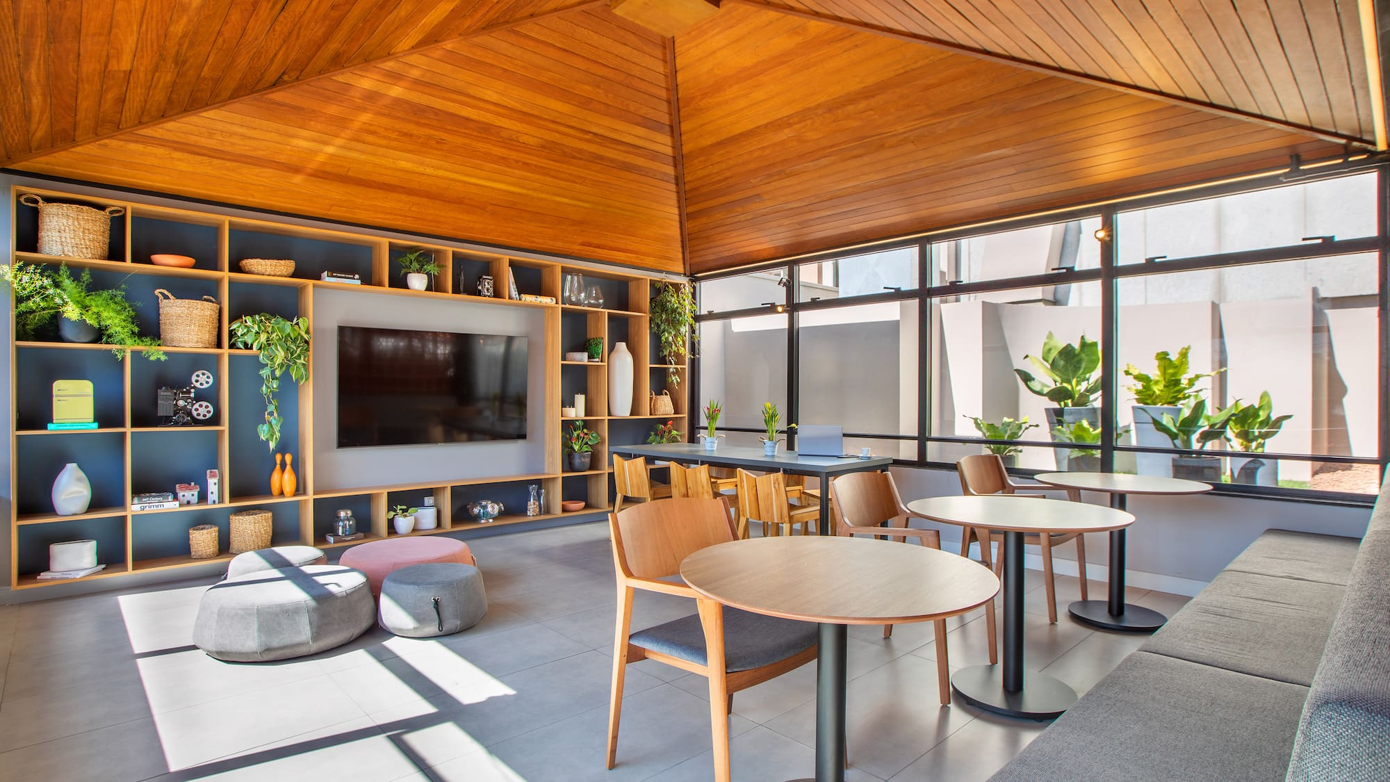 a room with a television and tables