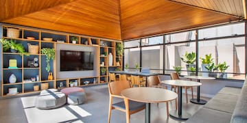 a room with a television and tables