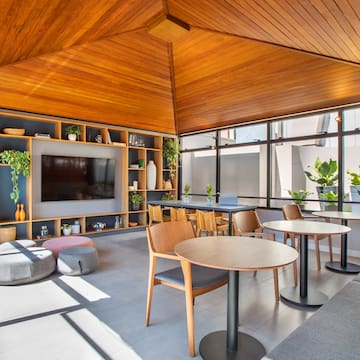 a room with a television and tables