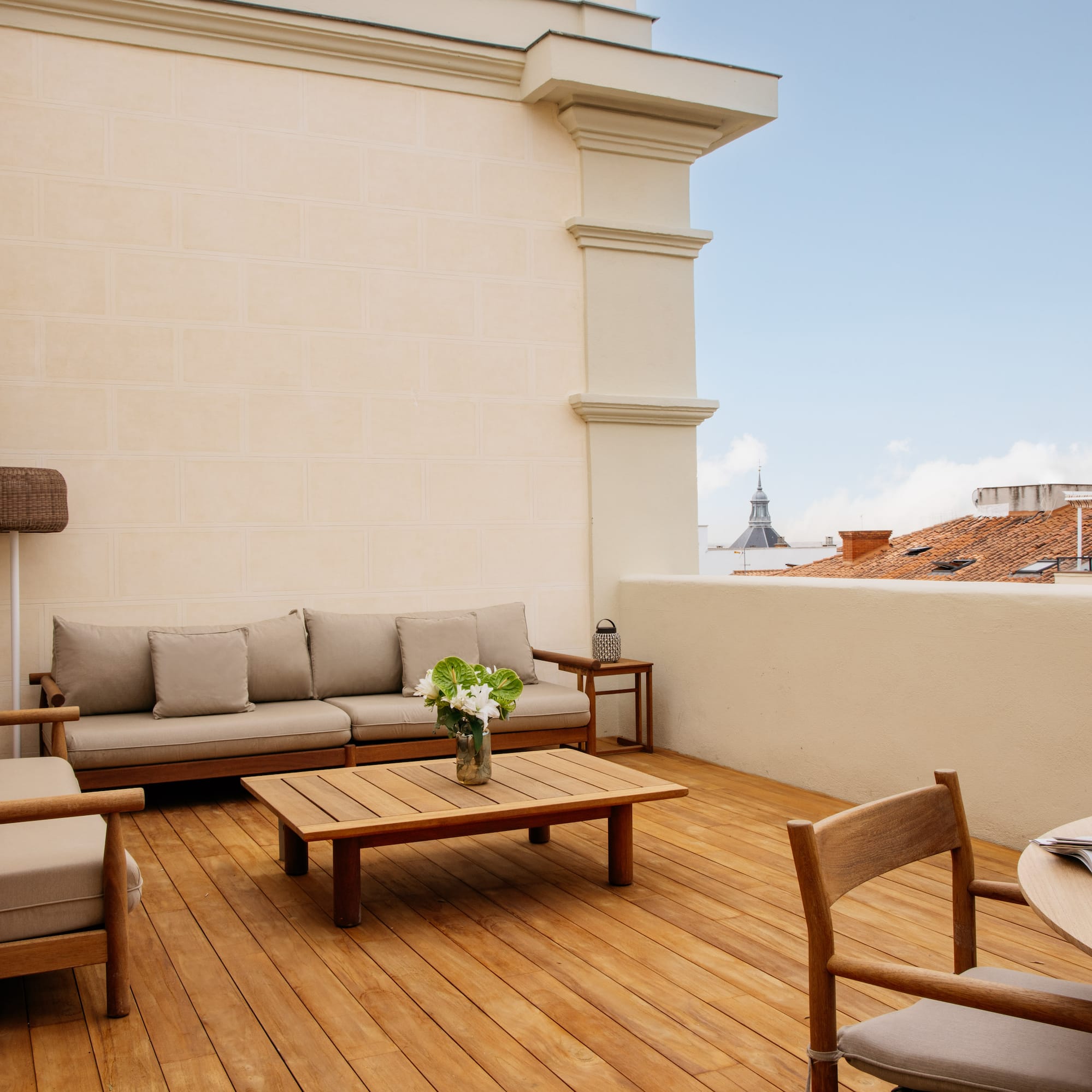 a patio with a table and chairs
