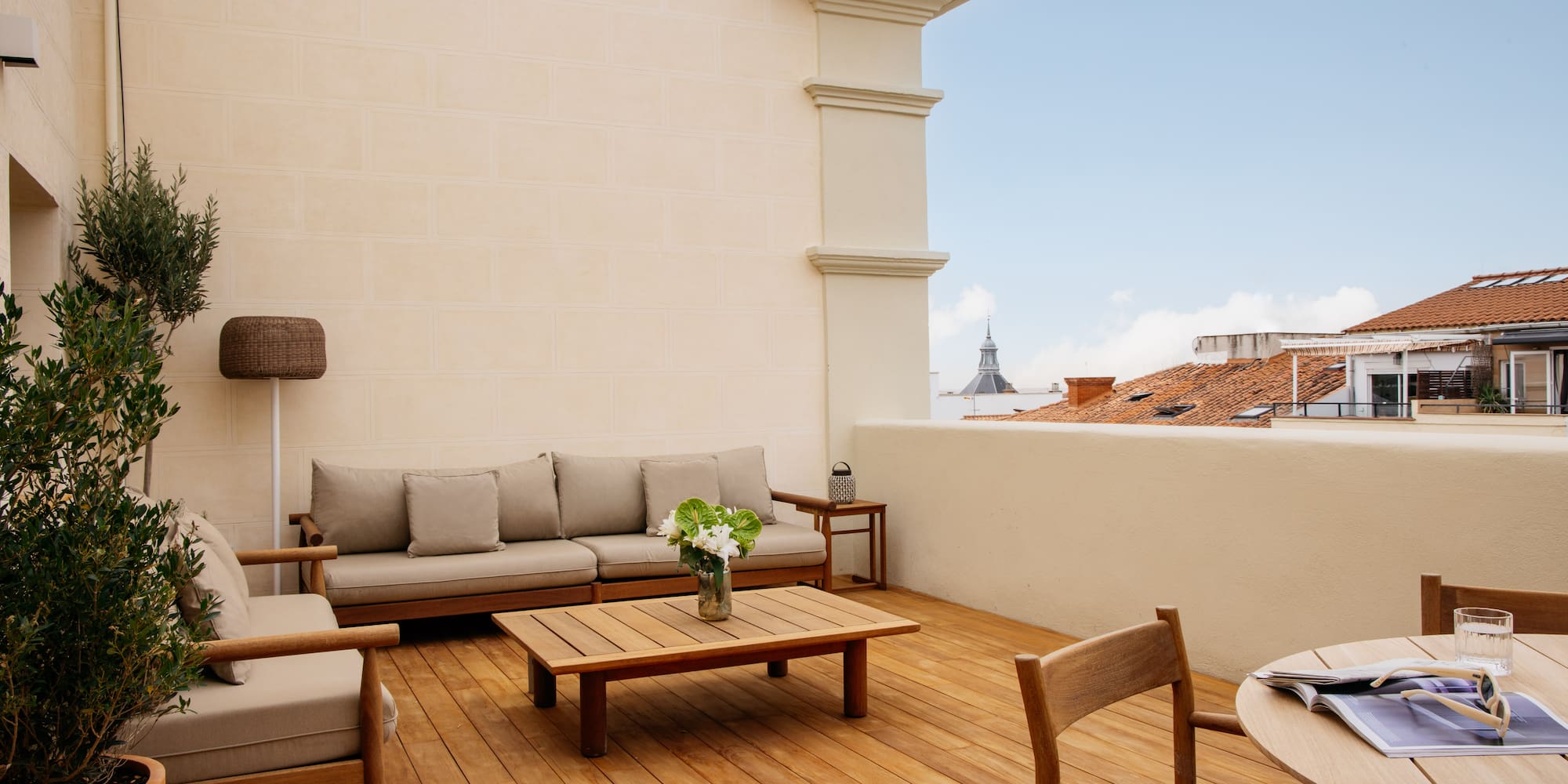 a patio with a table and chairs
