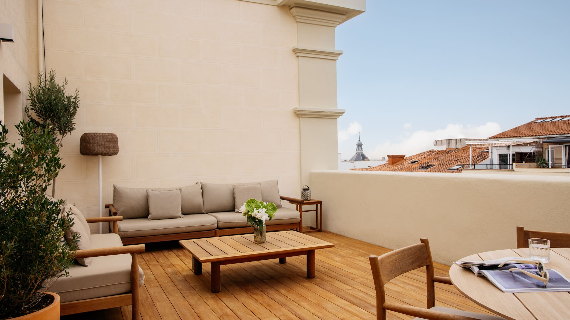 a patio with a table and chairs