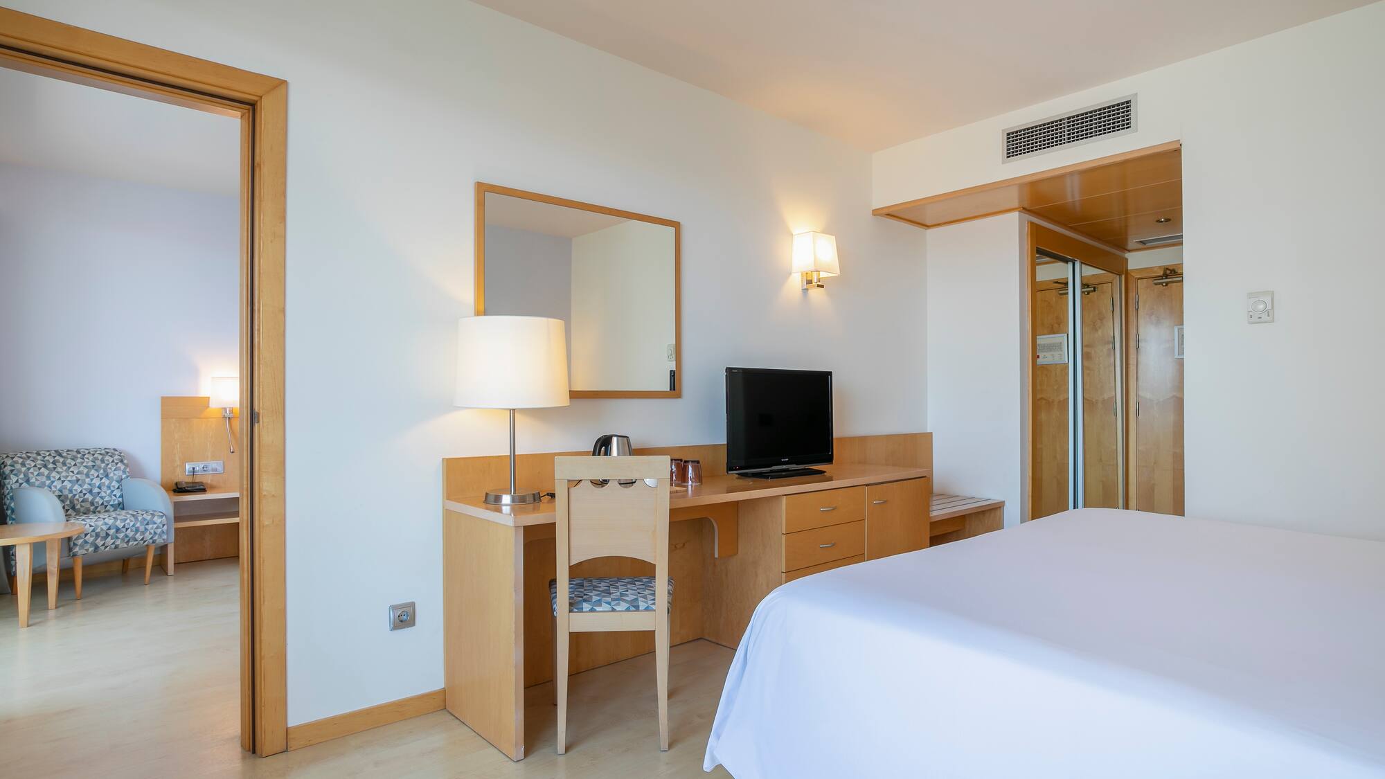 a room with a bed and a desk