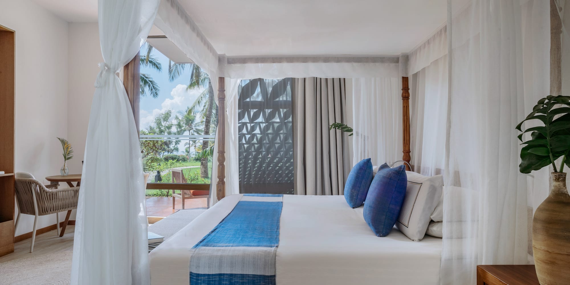Renovated Premium room with a canopy bed at Melia Zanzibar with garden views