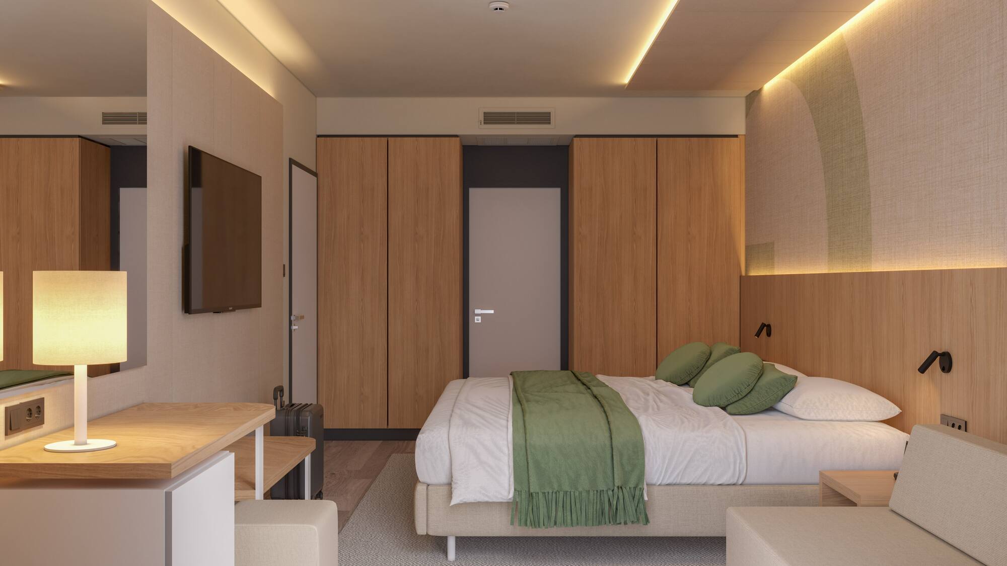 a bedroom with a bed and a tv